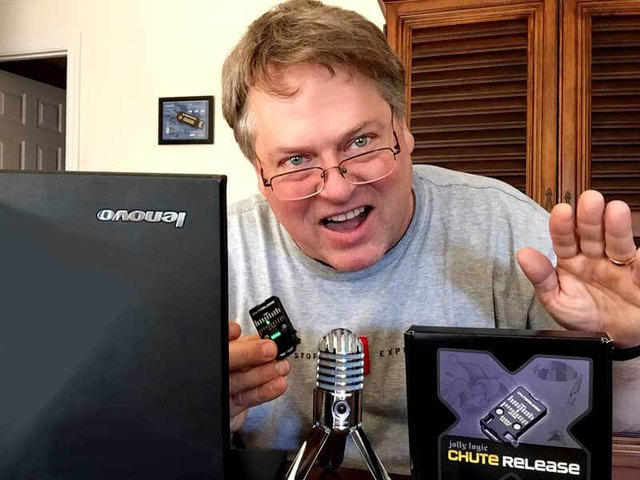 John Beans on The Rocketry Show podcast with a microphone and Chute Release